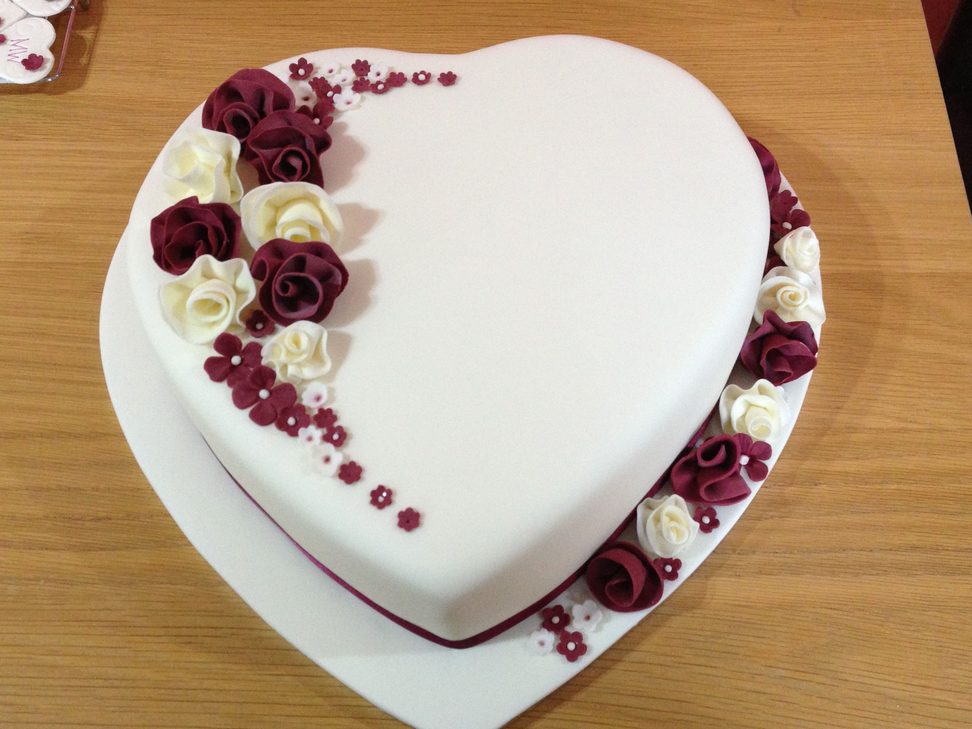 10 Beautiful Heart Shaped Cake Decorating Ideas heart shaped wedding cake with whimsical flowers fondant covered 2024