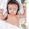 2 month old baby listening to music stock photo - image of indian