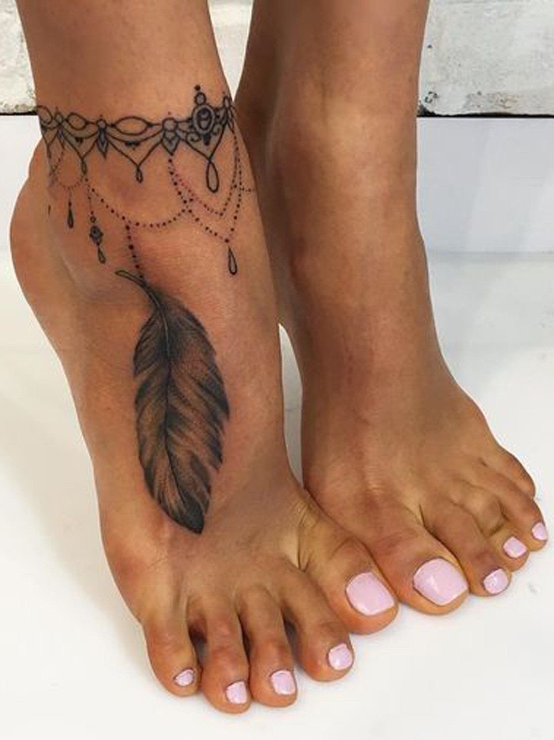 10 Perfect Tattoo Ideas For The Foot 20 feather tattoo ideas for women ankle foot tattoo black henna 3 2022