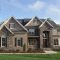 brick and stone exterior with a little siding | exterior of new home