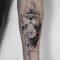 by koit, berlin. forearm black tattoo - lion, compass and illuminati