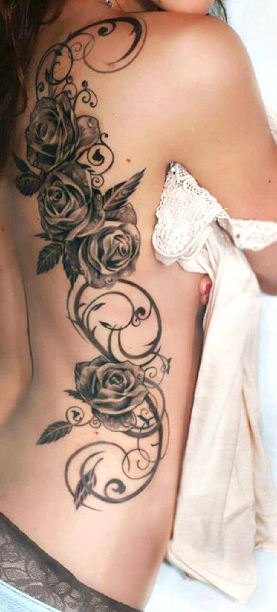 10 Elegant Tattoo Ideas For Side Of Body cute full rose rib swirl tattoo ideas for women victorian floral 2022