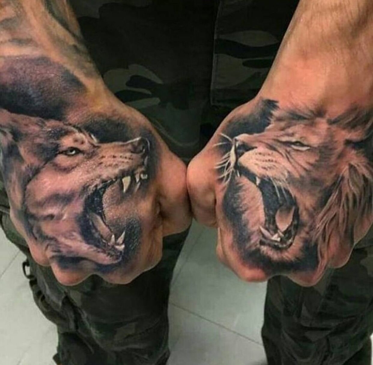 10 Gorgeous Badass Tattoo Ideas For Guys dope wolf vs lion hand tattoos wolf lion hand tattoo art 2022