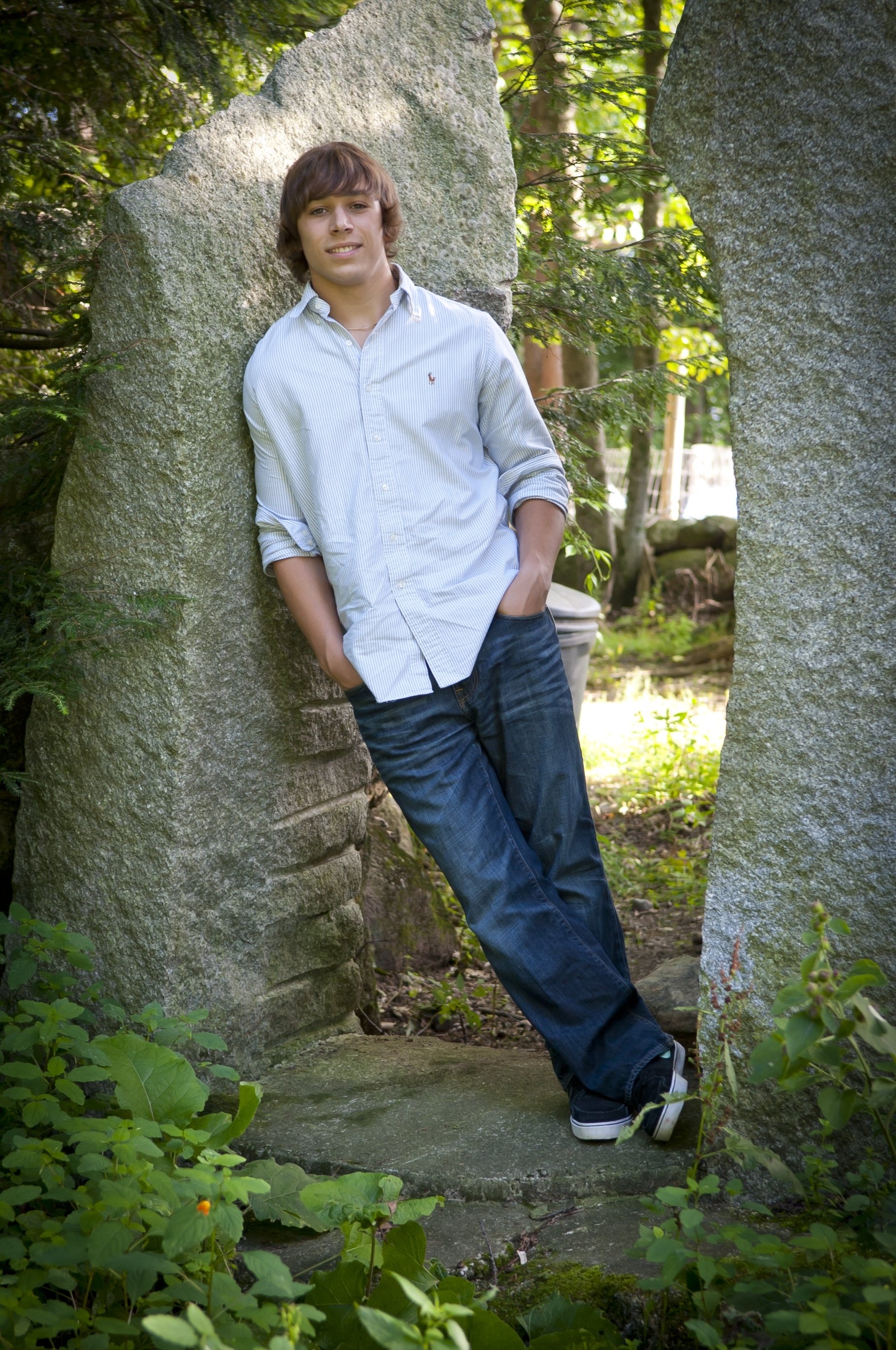10 Most Popular Senior Picture Ideas For Boys great casual pose between trees or concrete walls for a city look 2022