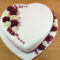 heart shaped wedding cake with whimsical flowers - fondant covered