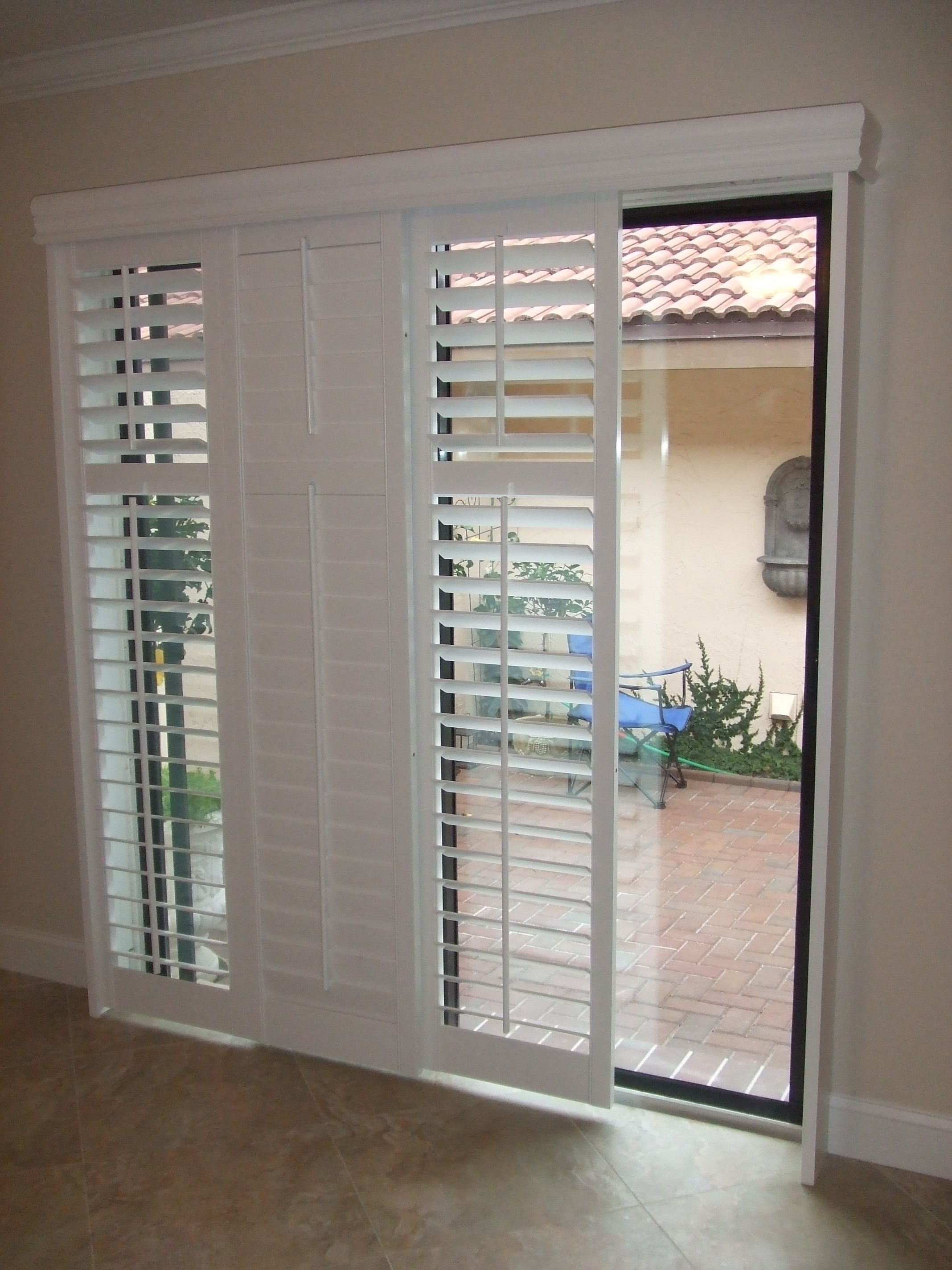 10 Lovely Blinds For Patio Doors Ideas modernize your sliding glass door with sliding plantation shutters 2022