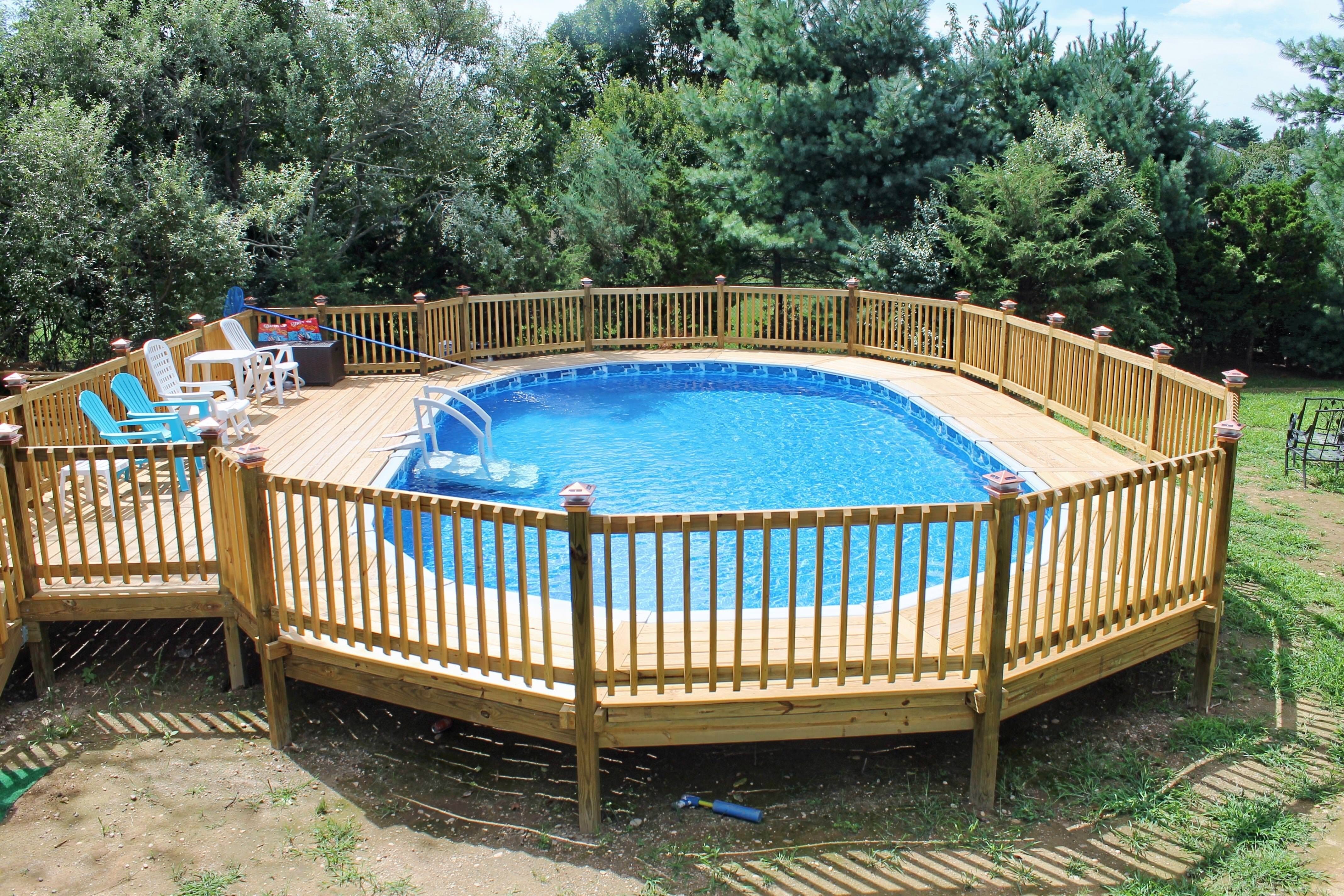 10 Unique Above Ground Pool Fencing Ideas octagonal above ground swimming pool design with wooden deck around 2022