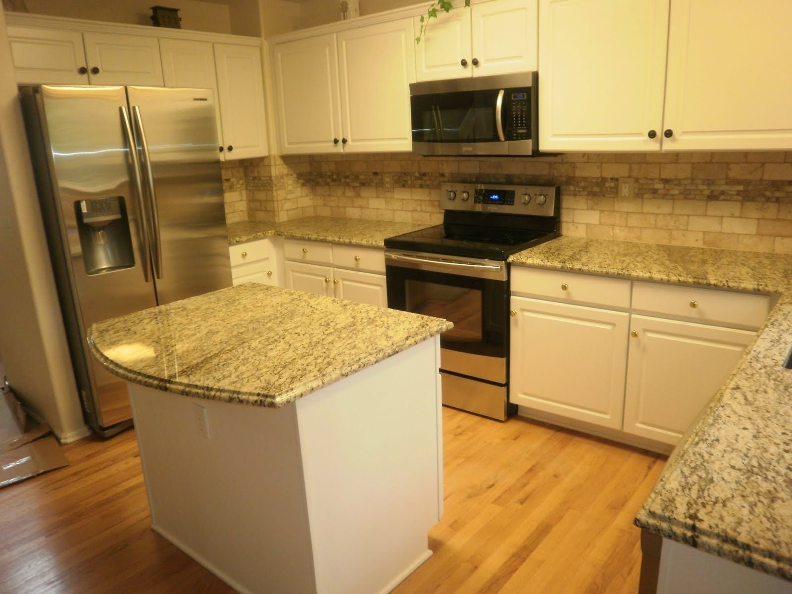 10 Stunning Santa Cecilia Granite Backsplash Ideas pictures of st cecilia granite with white cabinets kitchen 2022