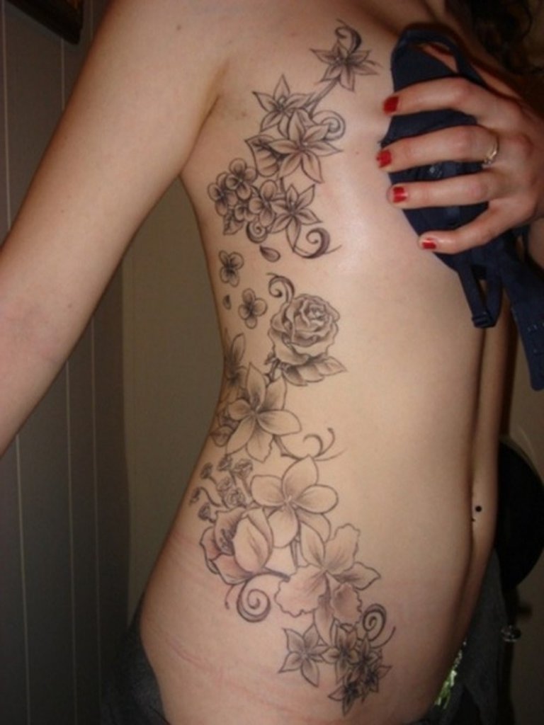 10 Elegant Tattoo Ideas For Side Of Body side tattoos of flowers flower side tattoo side body flower tattoos 2022