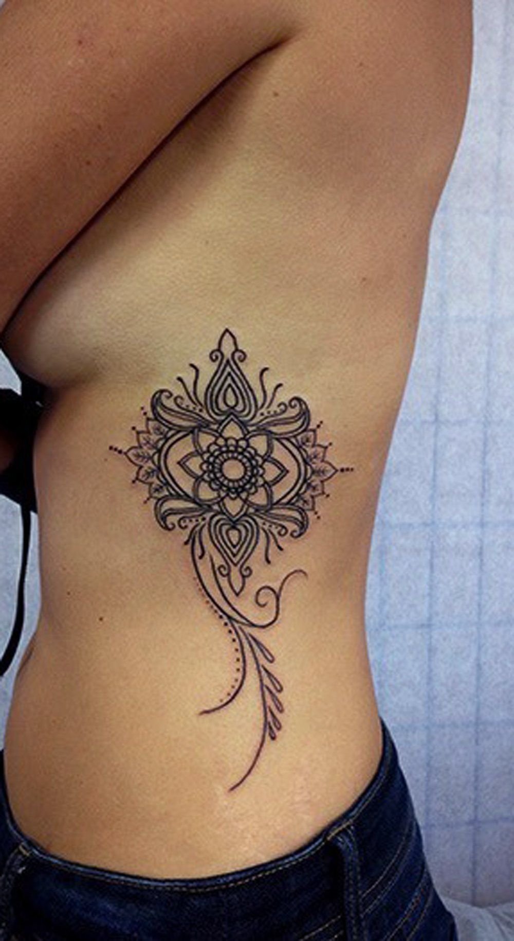 10 Elegant Tattoo Ideas For Side Of Body tribal mandala rib tattoo ideas for women cute lotus side body 2022